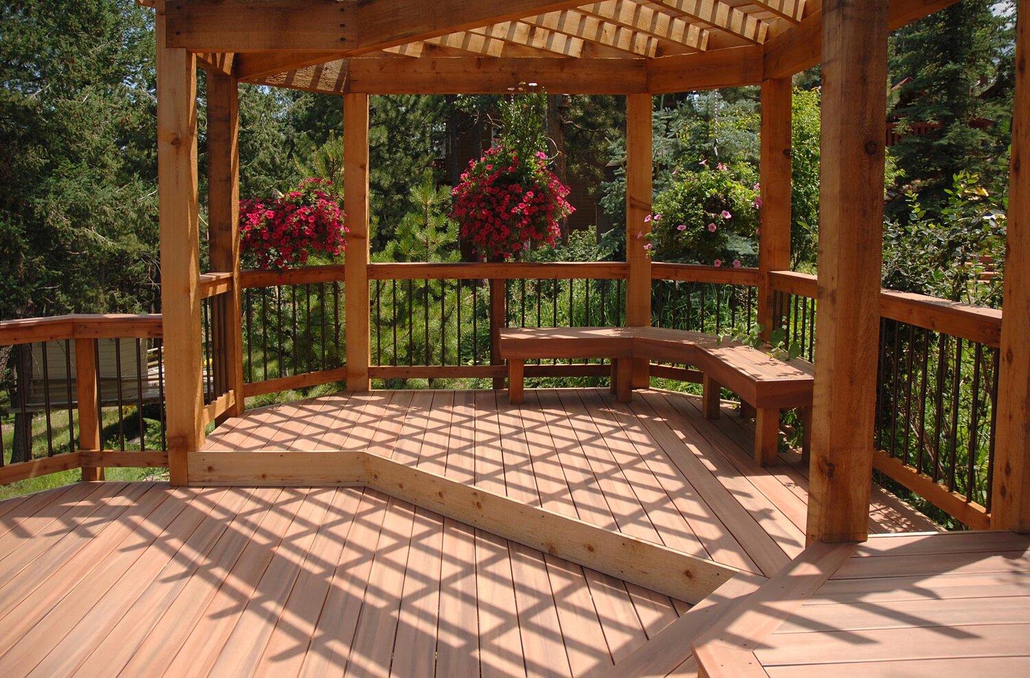 Multilevel decking and pergolas provide interest and shade to your backyard. Pictured is Fiberon Tropics composite decking in Jatoba from flickr.com. Link to license: creativecommons.org/licenses/by-nd/2.0.